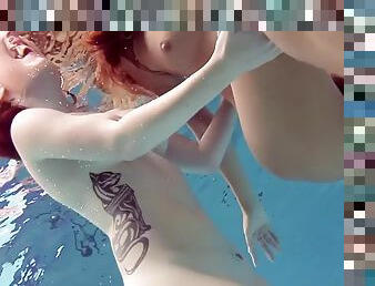 Naughty katrin and lucy swim naked in a swimming pool