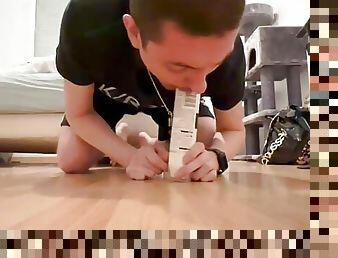 Submissive sucking a tube of shaving foam