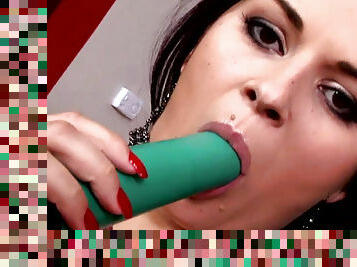 Dark-haired babe and her nice green dildo