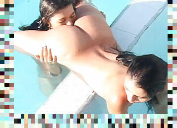 Naked lesbian is kissing her chick in the pool