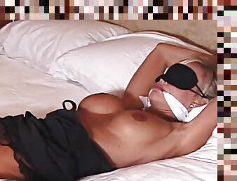 Bound gagged and blindfolded in bed