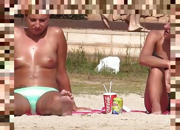 Tanned beach babe with totally perfect tits