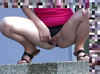 Tiny skirt on a hot girl pissing in public