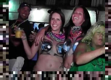 Mardi Gras party girls with painted tits