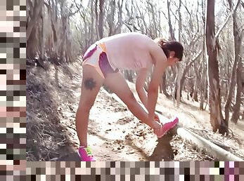 Jogger out on the trail poses her naked body