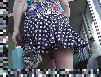 Small peek up a chick's skirt