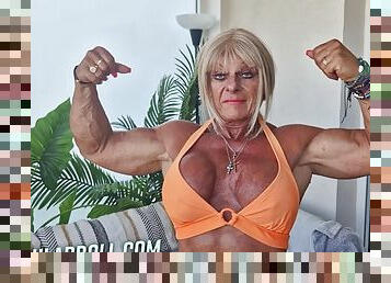 Muscular MILF with big fake boobs